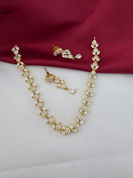 FeelOri Bollywood Glam AD Stone Statement Choker Set with matching earrings, full view on white and maroon background.