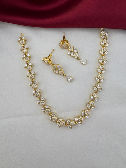 FeelOri Bollywood Glam AD Stone Statement Choker Set - elegant gold-tone necklace and drop earrings with sparkling AD stones.