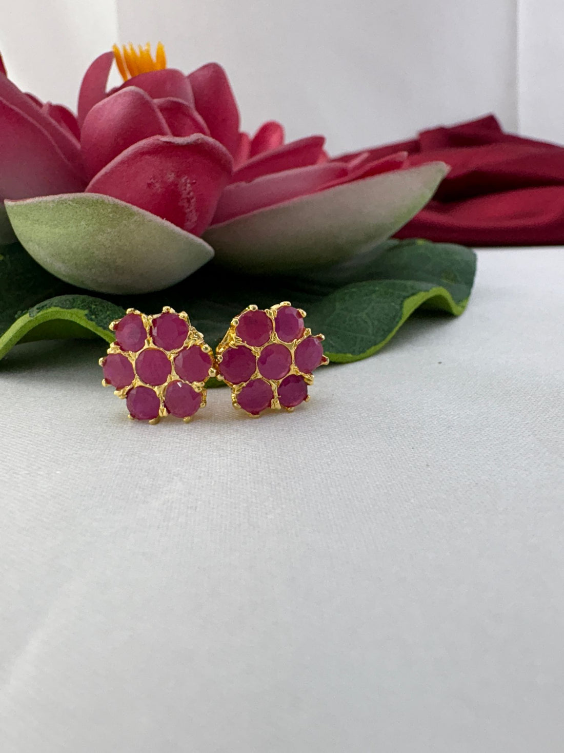 FeelOri bright fuchsia flash AD studs styled with lotus creating electric contemporary bold fashion statement