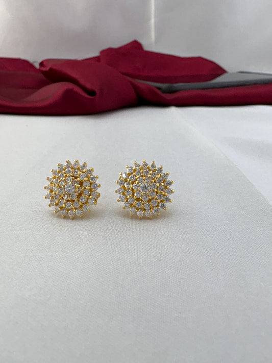 FeelOri Classic Sparkle white AD stud earrings pair on fabric background featuring brilliant clear stones in gold cluster