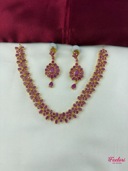 FeelOri Gold Plated Crimson Gemstone Necklace Set - Front view showcasing the complete set with necklace and matching earrings arranged