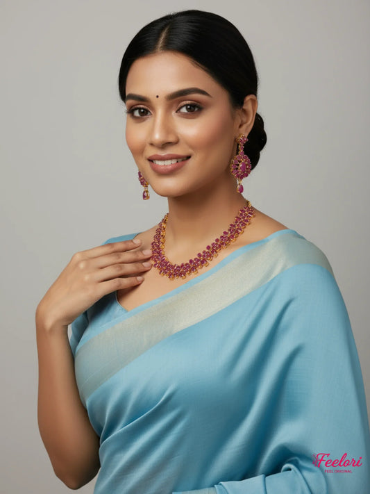 FeelOri Gold Plated Crimson Gemstone Necklace Set - Model wearing elegant set with light blue saree.