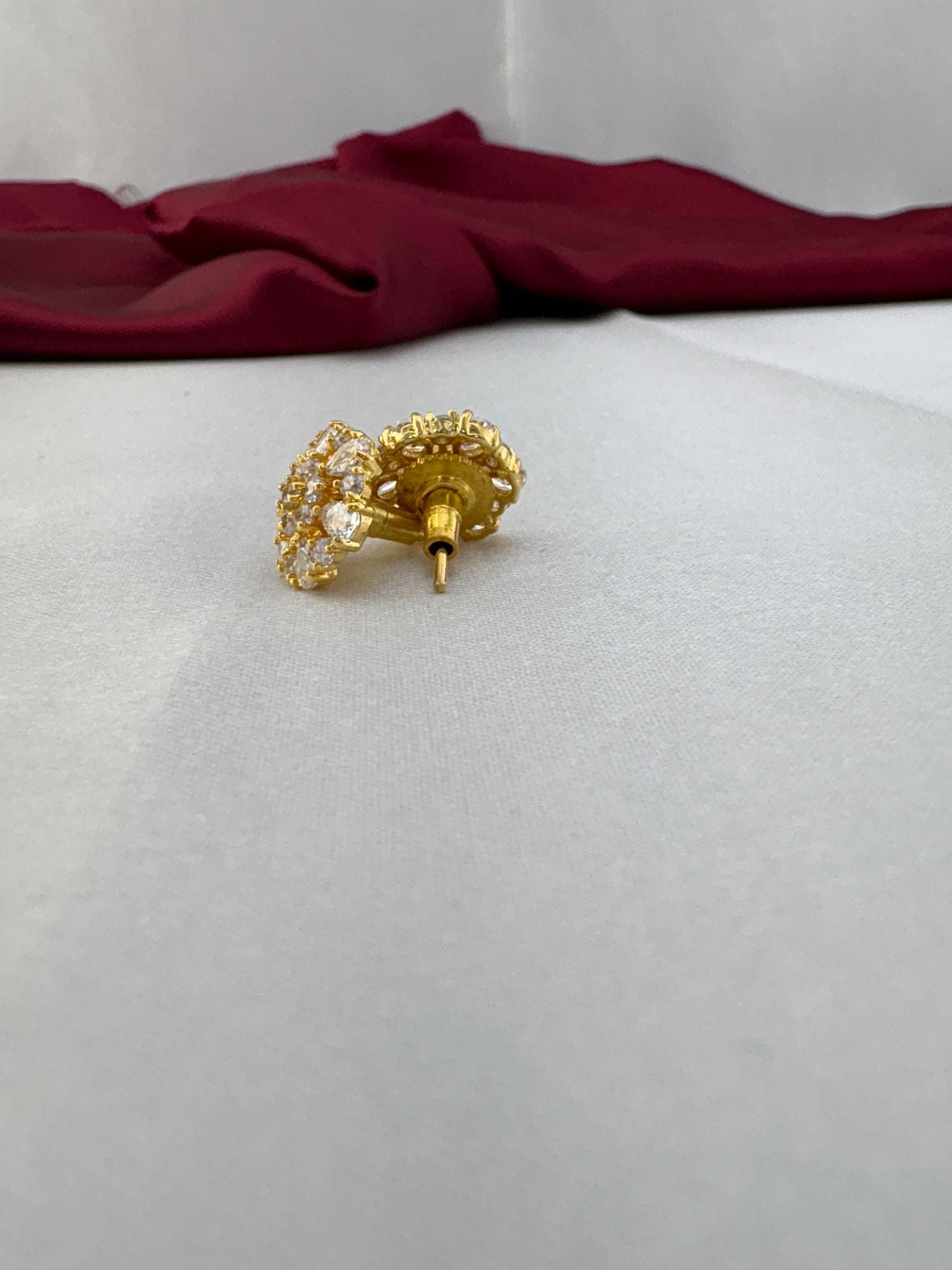 FeelOri Crystal Clear white brilliant cluster AD tops angled view displaying gold post mechanism and premium back