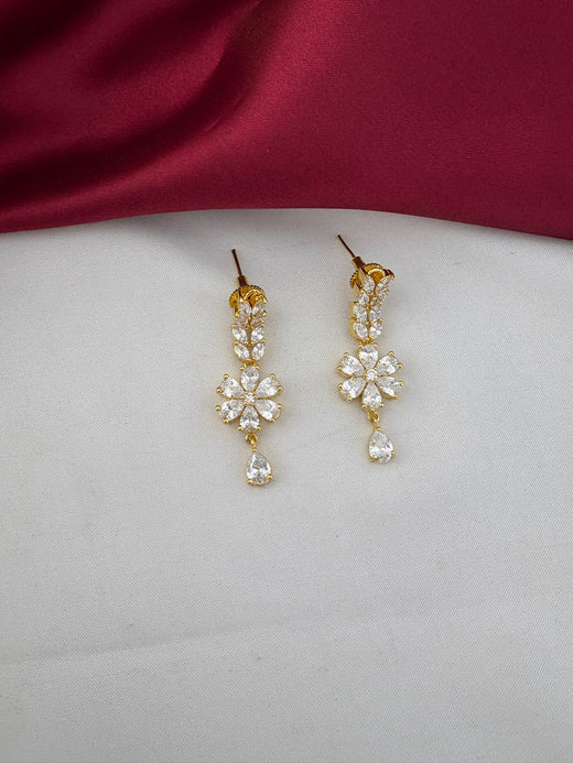 Detailed close-up of FeelOri Everyday Elegance AD Stone floral drop earrings