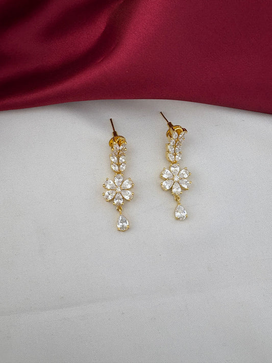Detailed close-up of FeelOri Everyday Elegance AD Stone floral drop earrings