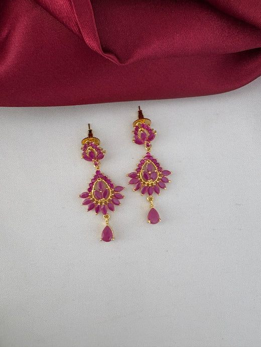 Close-up of FeelOri Exquisite Ruby-Tone CZ Earrings, part of the bridal short necklace set, showcasing detailed craftsmanship and rich ruby color.