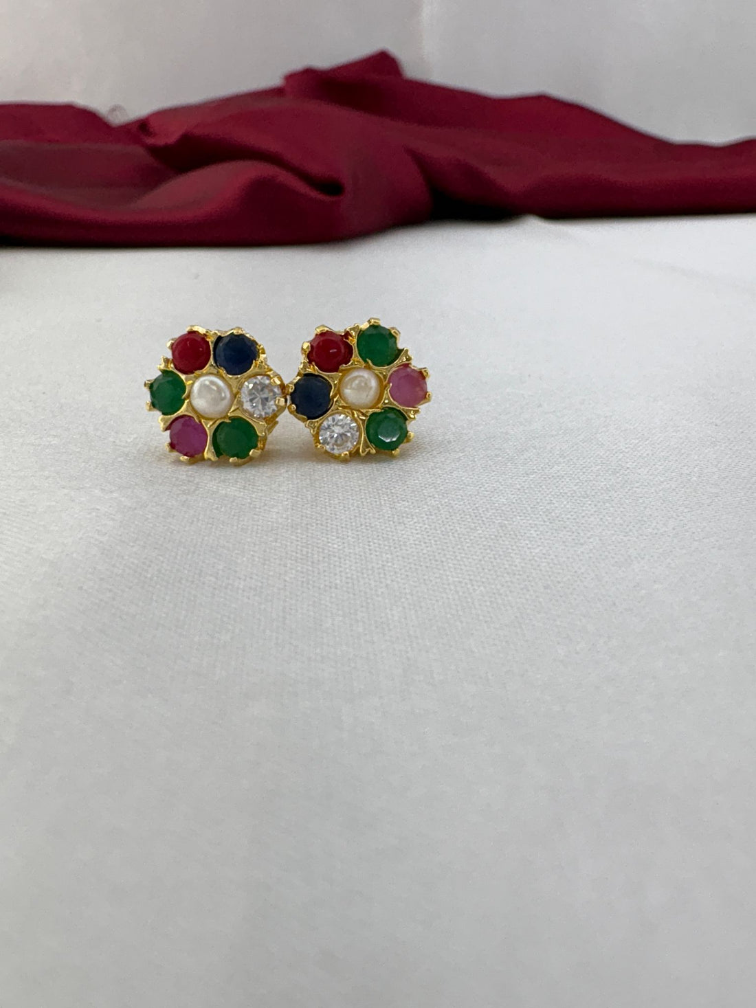 FeelOri Festive Navaratna classic round AD tops earrings pair showcasing traditional nine gemstone circular design