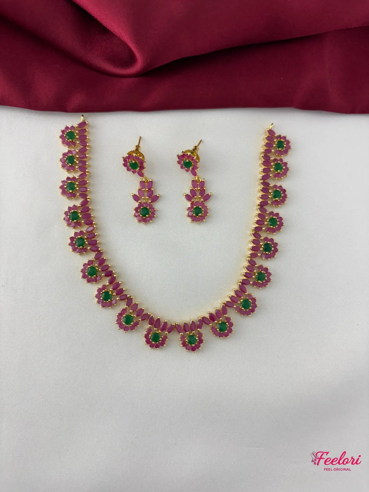 FeelOri Gold Plated Ruby Emerald Necklace Set - Front view showcasing the delicate petal cluster design and vibrant gemstone arrangement.