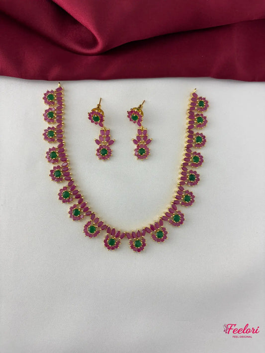 FeelOri Gold Plated Ruby Emerald Necklace Set - Front view showcasing the delicate petal cluster design and vibrant gemstone arrangement.