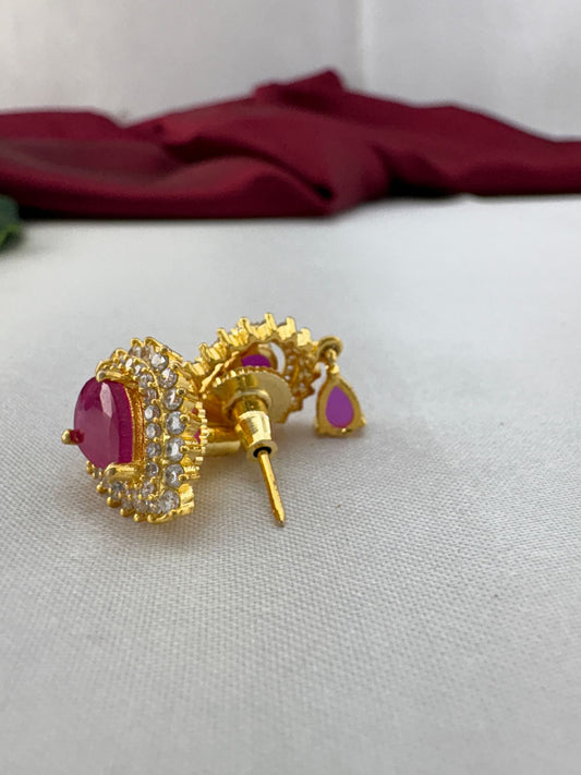 FeelOri Fuchsia Flash bright pink AD stud earrings angled view displaying gold post mechanism and secure back