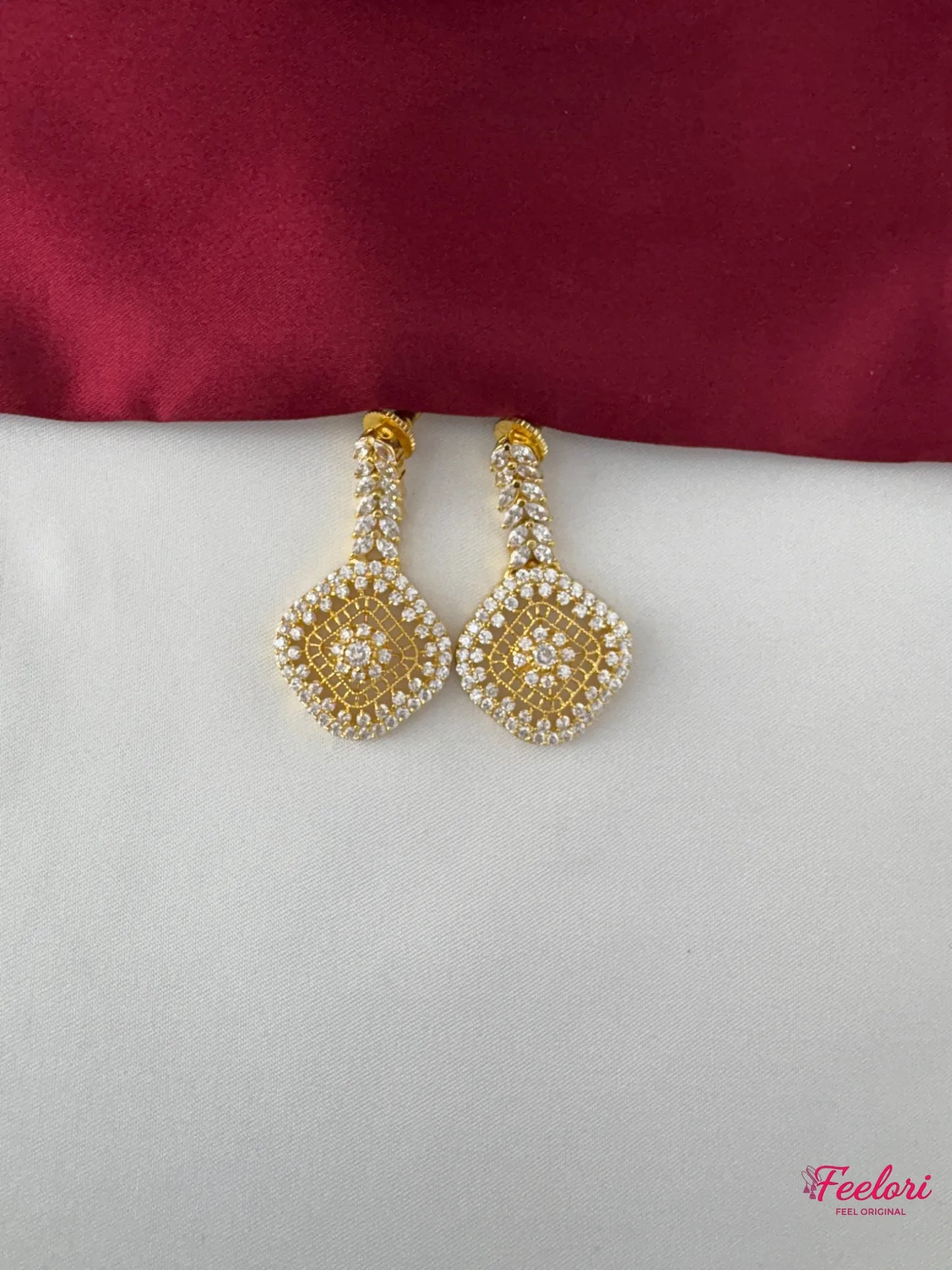 FeelOri Gold Plated Diamond Stimulant Earrings - Detailed close-up showing the shimmering square motif design and push-back finding.