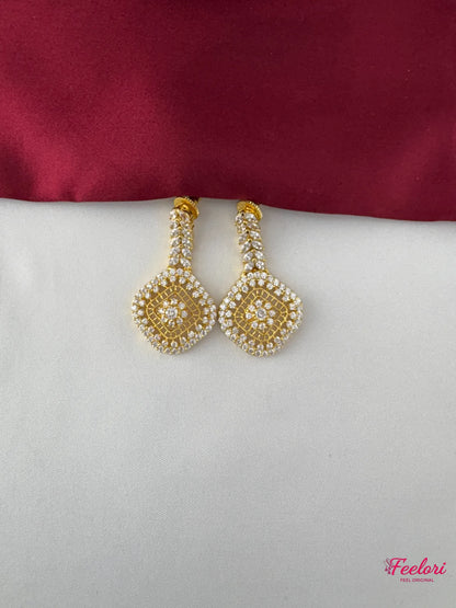 FeelOri Gold Plated Diamond Stimulant Earrings - Detailed close-up showing the shimmering square motif design and push-back finding.