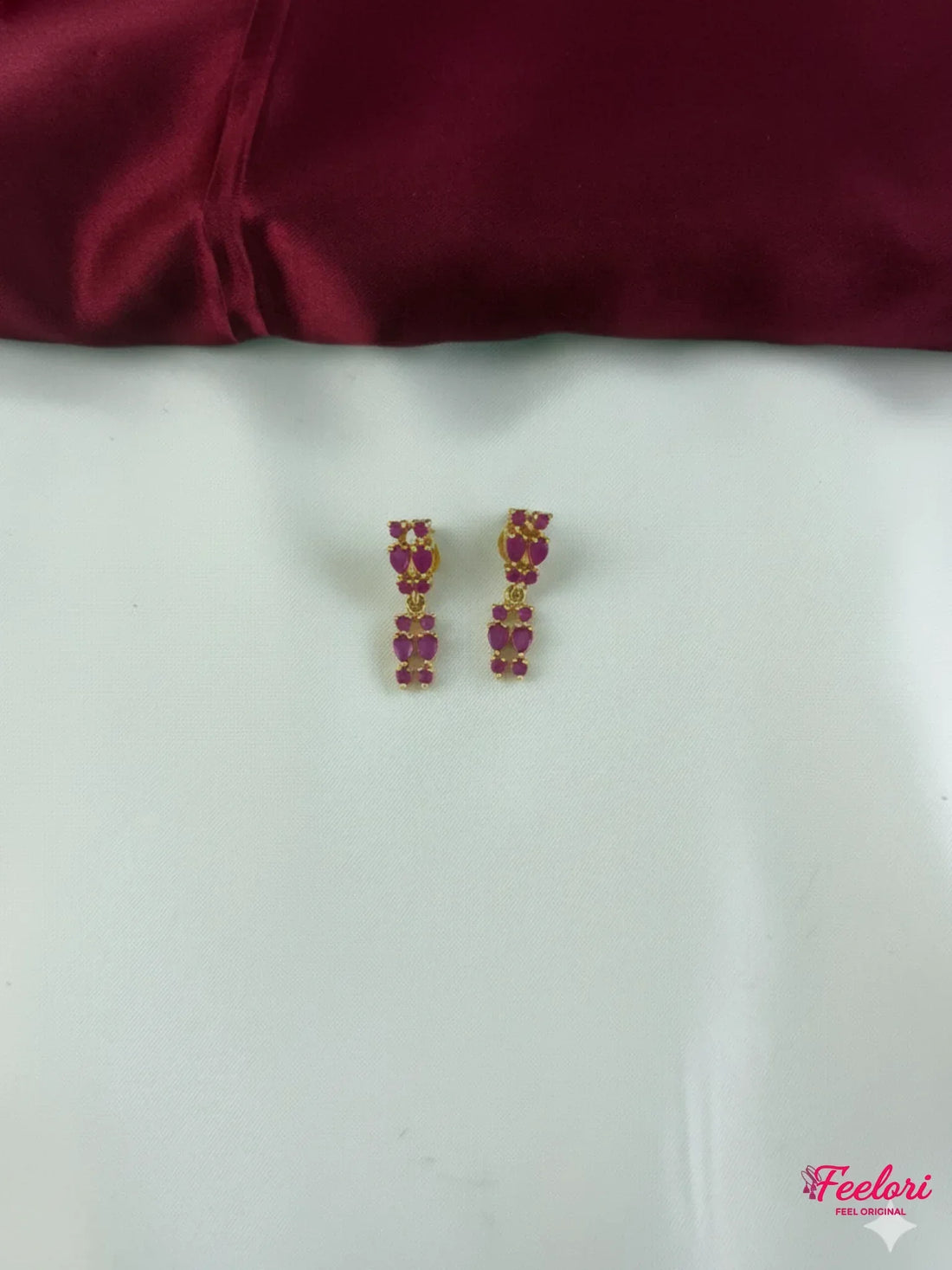 FeelOri Gold Plated Ruby Drop Earrings - Detailed view of the matching drop earrings, highlighting their intricate ruby-like stone arrangement and gold plating.