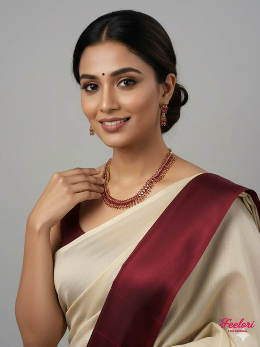 FeelOri Ruby Drop Necklace Set - Model in traditional saree, elegantly displaying gold plated set.