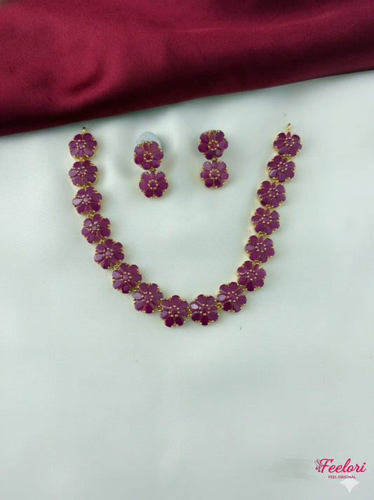 FeelOri Gold Plated Ruby Dual Flower Necklace Earring Set - Front view showcasing the complete set with interconnected floral motifs.