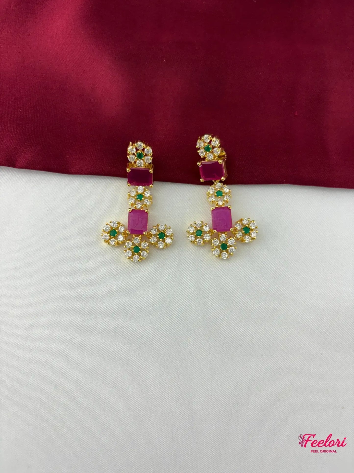 FeelOri Gold Plated Emerald Ruby Floral Earrings - detailed close-up showing the intricate floral arrangement of clear CZ and emerald stones, with a central rectangular ruby.