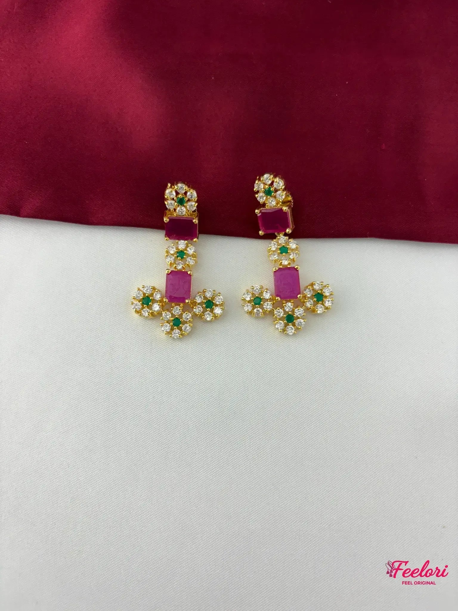 FeelOri Gold Plated Emerald Ruby Floral Earrings - detailed close-up showing the intricate floral arrangement of clear CZ and emerald stones, with a central rectangular ruby.
