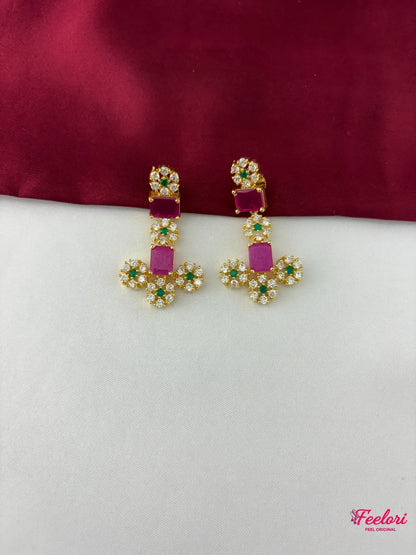 FeelOri Gold Plated Emerald Ruby Floral Earrings - detailed close-up showing the intricate floral arrangement of clear CZ and emerald stones, with a central rectangular ruby.