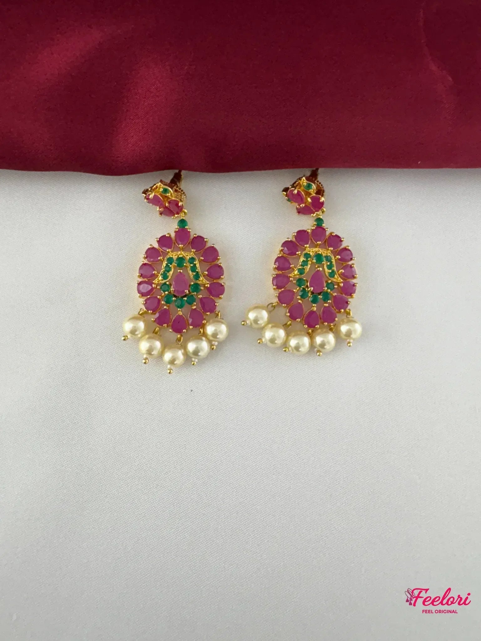 FeelOri Gold Plated Ruby Emerald Drop Earrings - Detailed view highlighting the intricate floral pattern, ruby and emerald stones, and delicate pearl drops.
