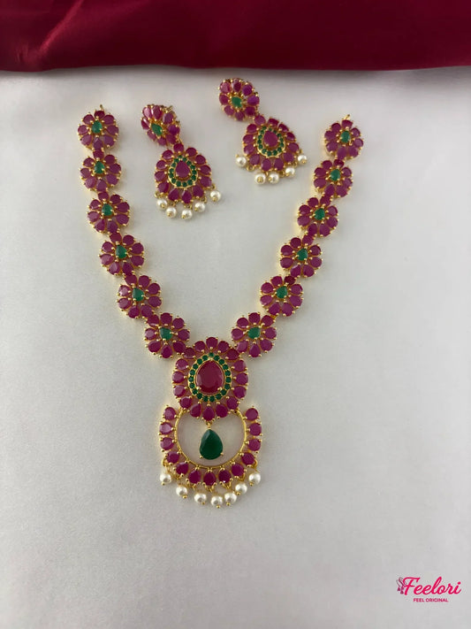 FeelOri Gold Plated Floral Ruby Emerald Necklace Set - Front view showcasing the central pendant and matching floral patterns.