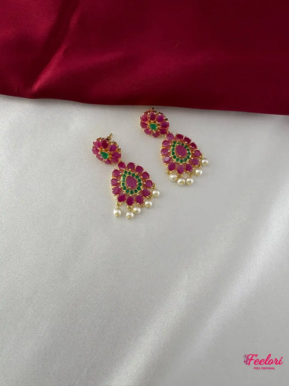 FeelOri Gold Plated Floral Ruby Emerald Earrings - Close-up view revealing the intricate stone setting and natural pearl drops.