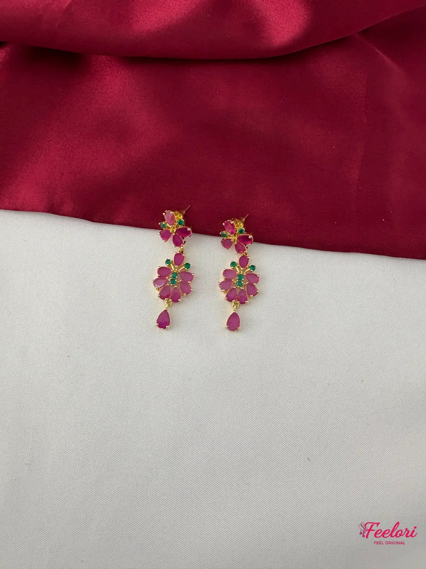 FeelOri Gold Plated Ruby Emerald Drop Earrings - Close-up view highlighting the intricate floral petal arrangement of the Ruby-Tone CZ and emerald stones.