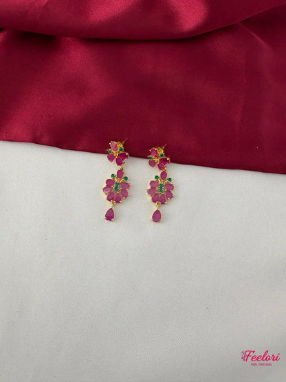 FeelOri Gold Plated Ruby Emerald Drop Earrings - Close-up view highlighting the intricate floral petal arrangement of the Ruby-Tone CZ and emerald stones.
