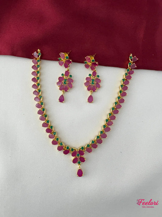 FeelOri Gold Plated Ruby Emerald Floral Petal Drop Necklace Set - Full set view showing necklace with delicate chain and matching earrings.