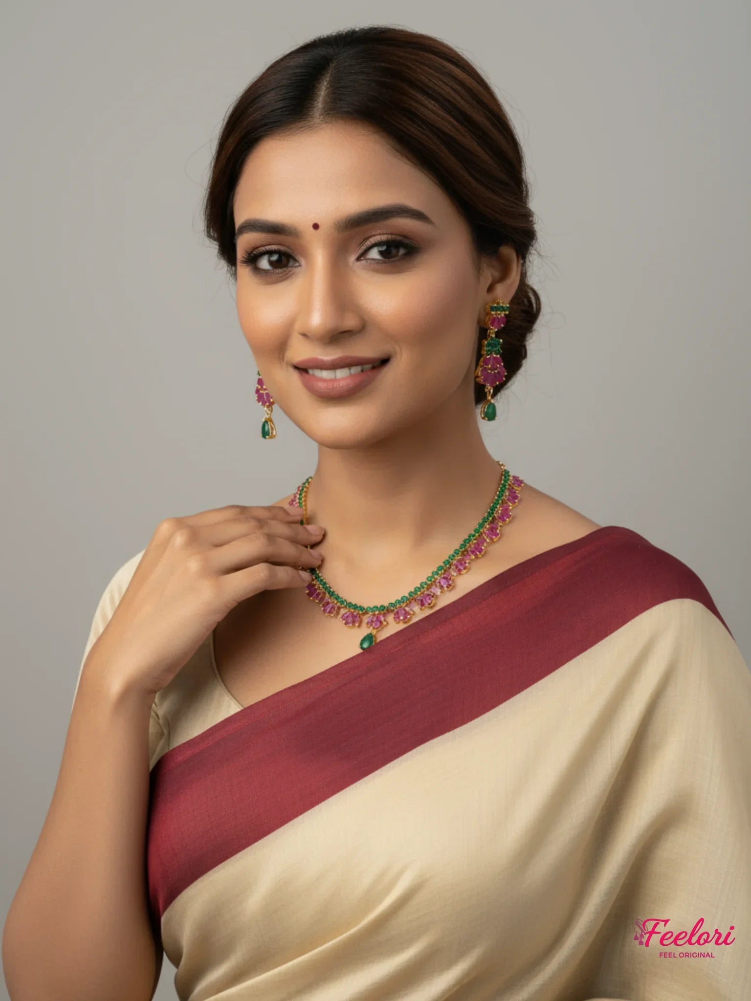FeelOri Gold Plated Ruby Emerald Necklace Set - Model wearing floral design with traditional saree.
