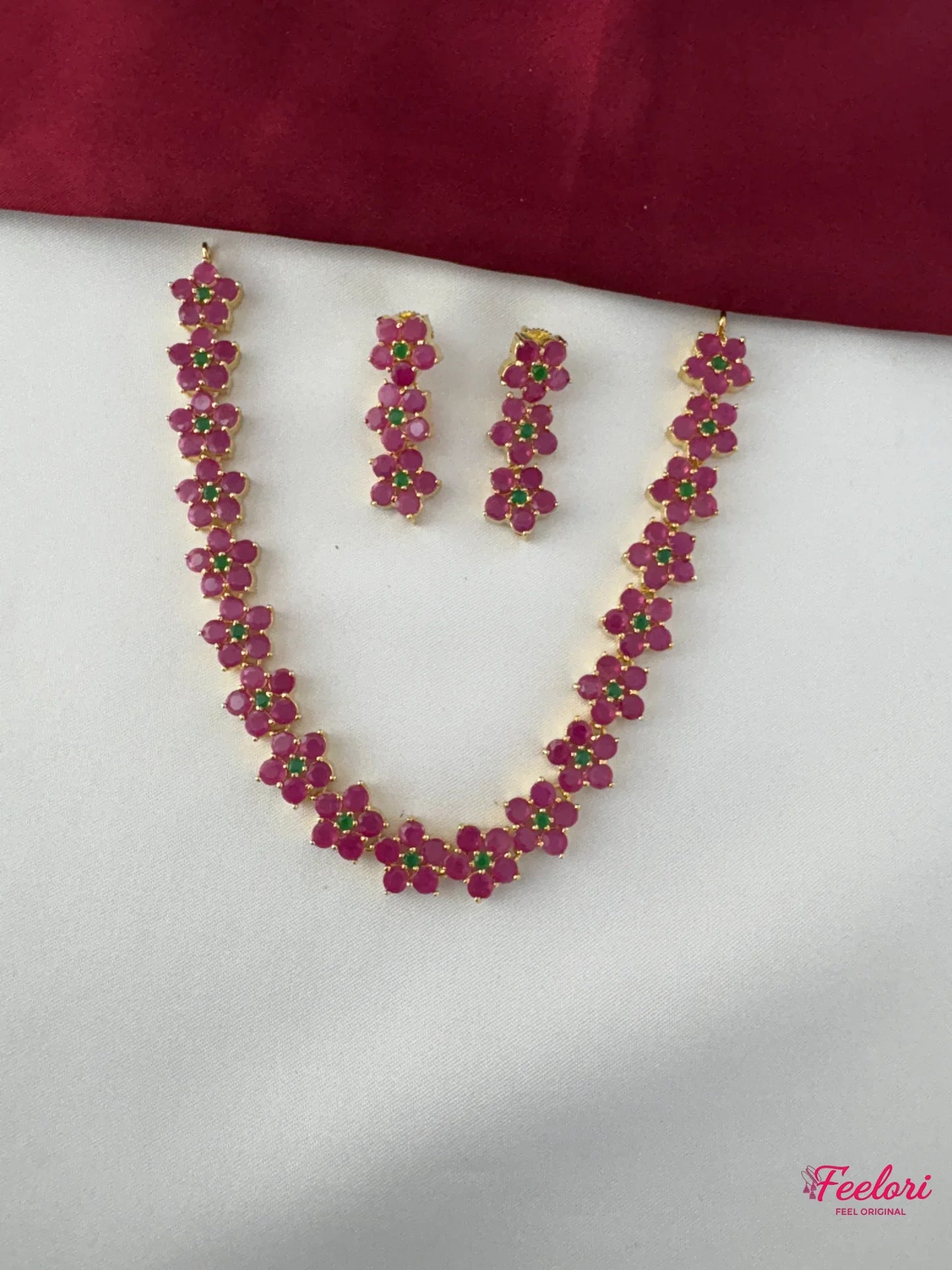 FeelOri Gold Plated Ruby Emerald Flower Chain Necklace Set - Full view displaying the intricate floral clusters on the necklace and matching earrings.