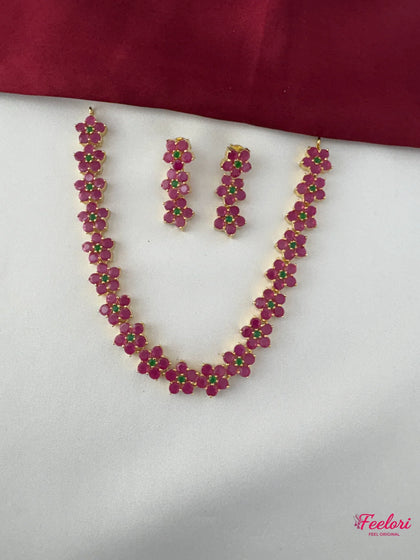 FeelOri Gold Plated Ruby Emerald Flower Chain Necklace Set - Full view displaying the intricate floral clusters on the necklace and matching earrings.