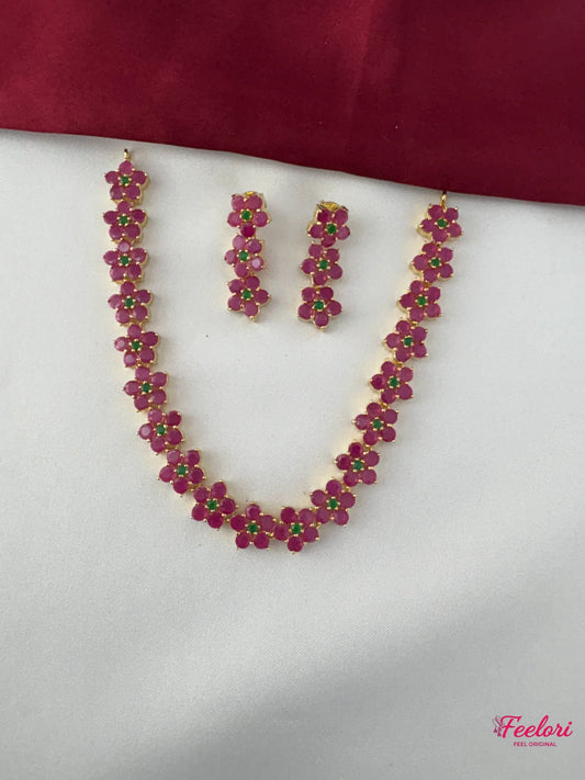 FeelOri Gold Plated Ruby Emerald Flower Chain Necklace Set - Full view displaying the intricate floral clusters on the necklace and matching earrings.