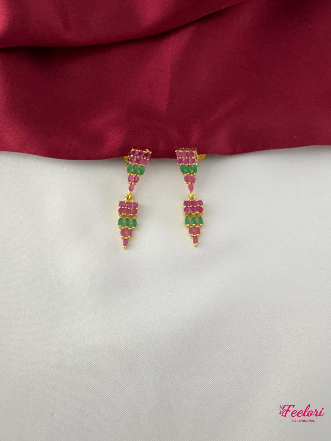 FeelOri Gold Plated Ruby Emerald Drop Earrings - Close-up view highlighting the detailed arrangement of Ruby CZ and emerald stones.