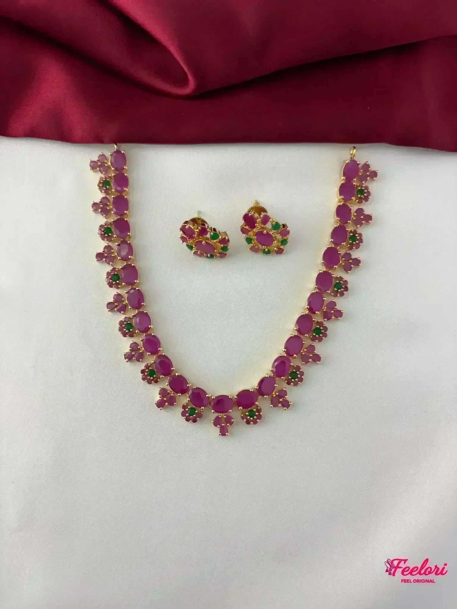 FeelOri Gold Plated Ruby Emerald Petal Necklace Set - Front view showcasing the full necklace and matching earrings with vibrant stone clusters.
