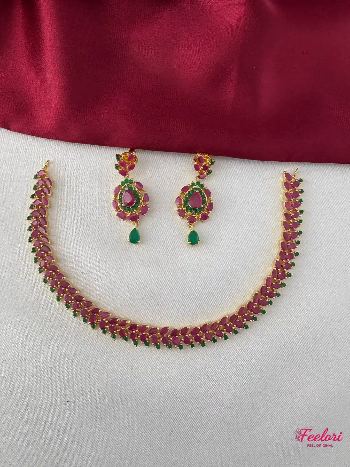 FeelOri Gold Plated Ruby Emerald Leaf Necklace Set - Front view showcasing the complete unique leaf-patterned necklace and matching earrings.