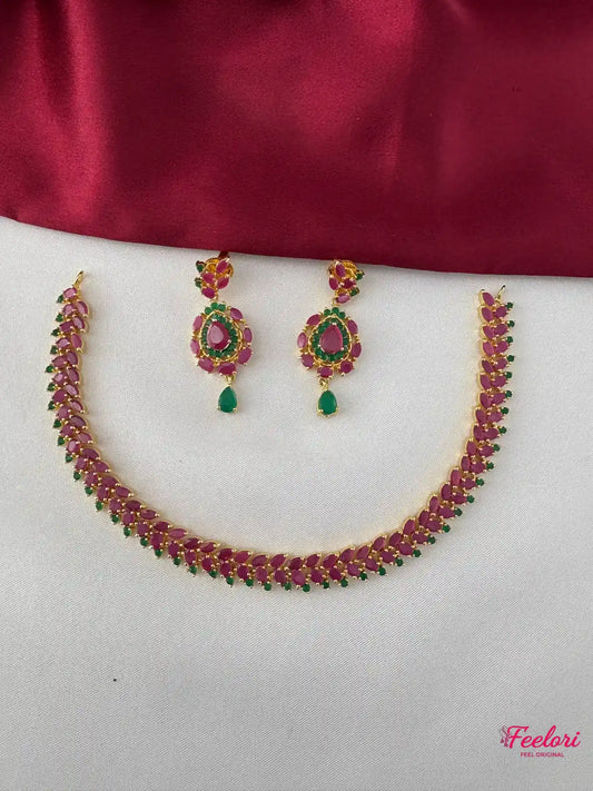 FeelOri Gold Plated Ruby Emerald Leaf Necklace Set - Front view showcasing the complete unique leaf-patterned necklace and matching earrings.