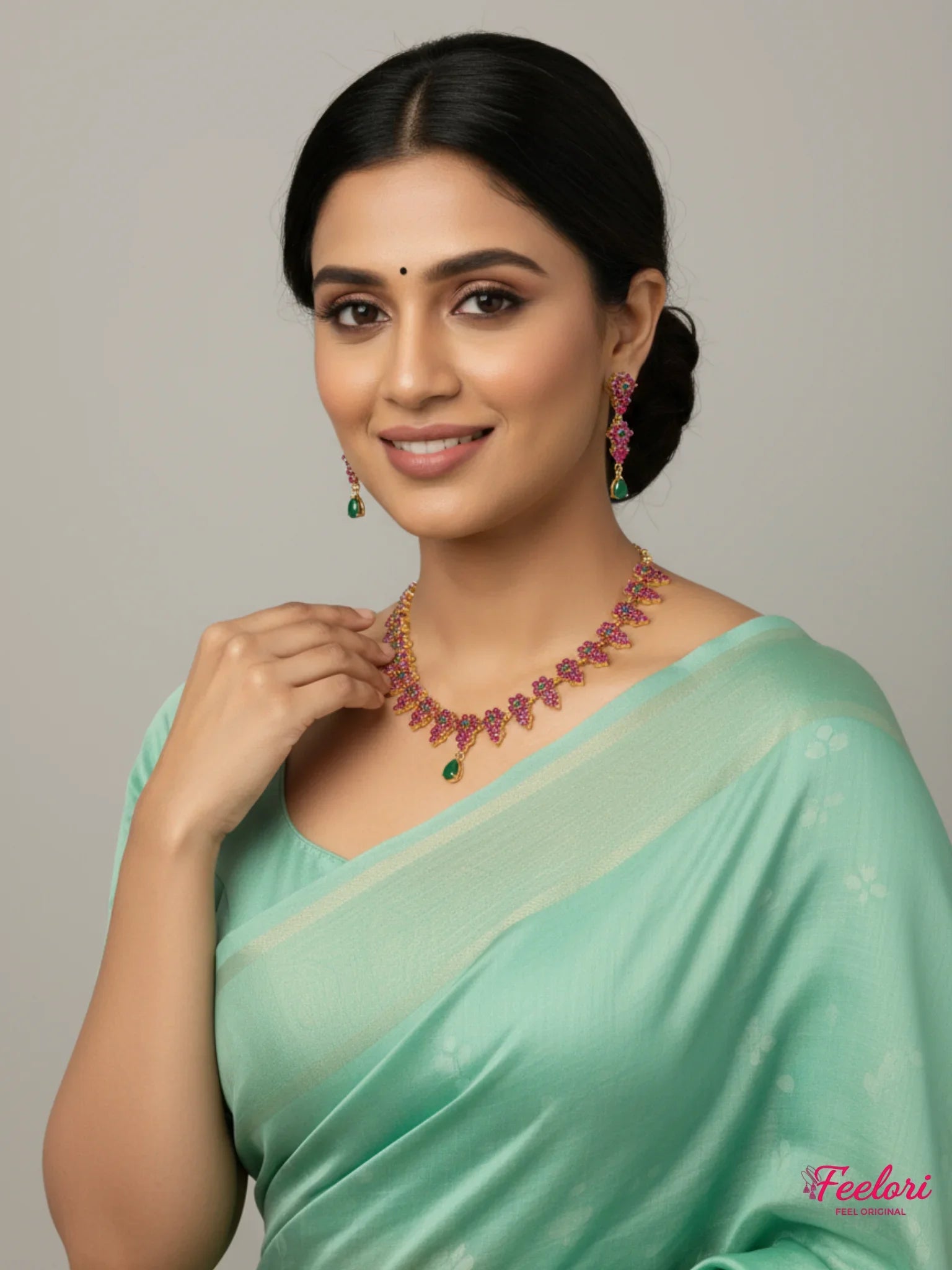 FeelOri Gold Plated Ruby Emerald Vine Necklace Set - Model in green saree wearing delicate set.