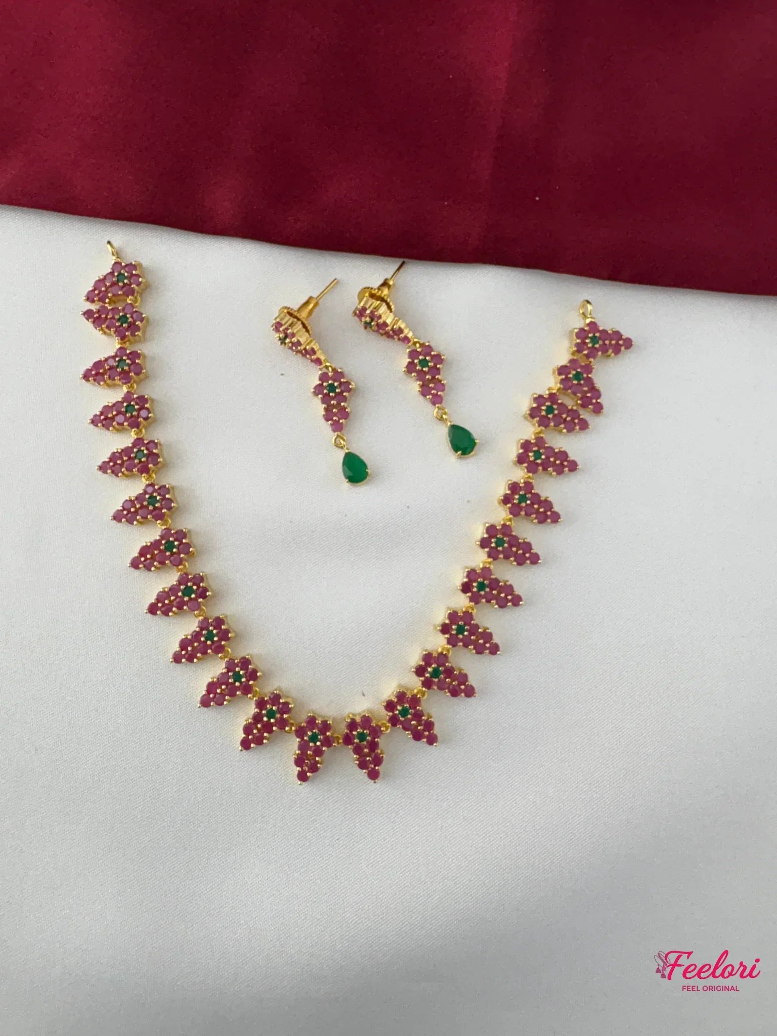 FeelOri Gold Plated Ruby Emerald Vine Necklace Set - Overhead view showcasing the full set with delicate ruby clusters and emerald drops.
