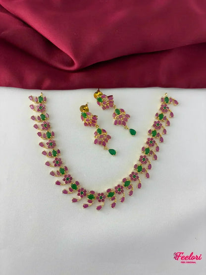 FeelOri Gold Plated Ruby Emerald Necklace Set - Top view showcasing the full necklace and matching earrings with blooming vine design.