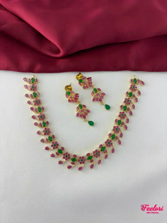 FeelOri Gold Plated Ruby Emerald Necklace Set - Top view showcasing the full necklace and matching earrings with blooming vine design.