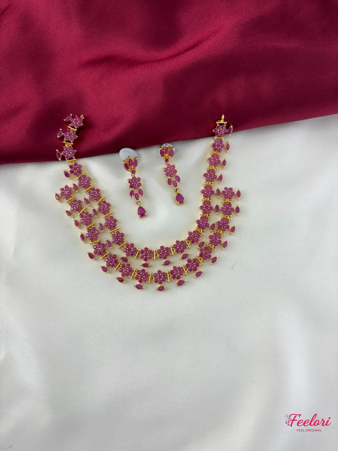 FeelOri Gold Plated Ruby Floral Layered Necklace Set - Front view showcasing the two-tiered design and matching earrings.