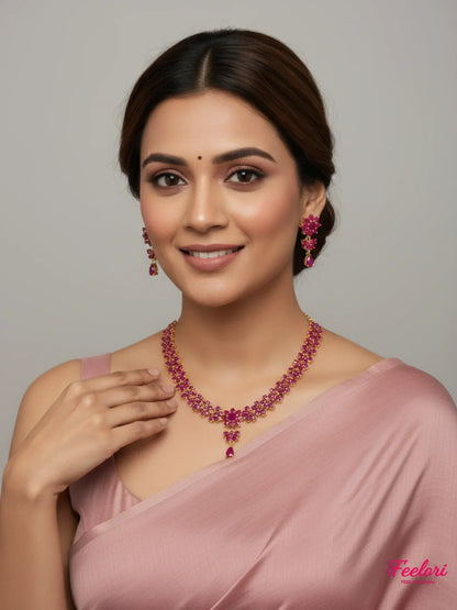 FeelOri Gold Plated Ruby Floral Necklace Set - Model wearing elegant set with pink saree.