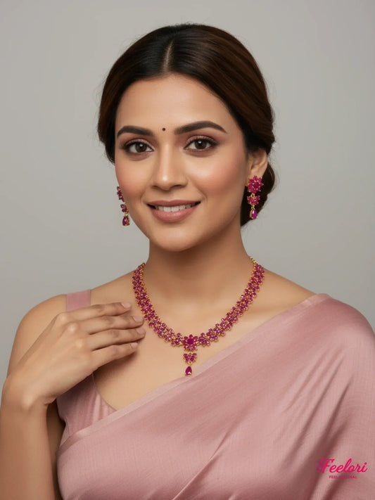 FeelOri Gold Plated Ruby Floral Necklace Set - Model wearing elegant set with pink saree.