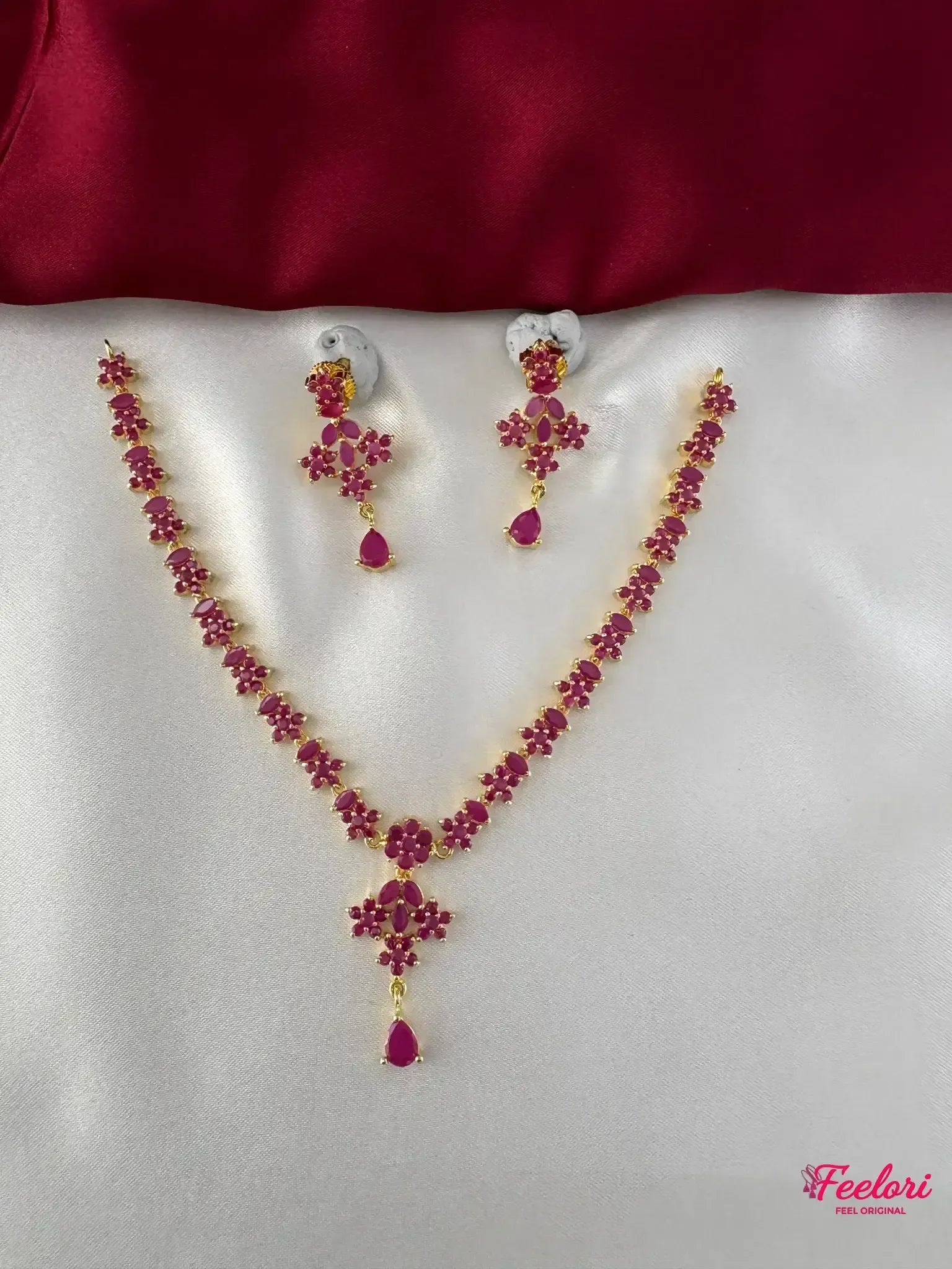 FeelOri Gold Plated Ruby Floral Necklace Set - Full view showcasing the necklace with pear and round ruby-toned stones and matching earrings.