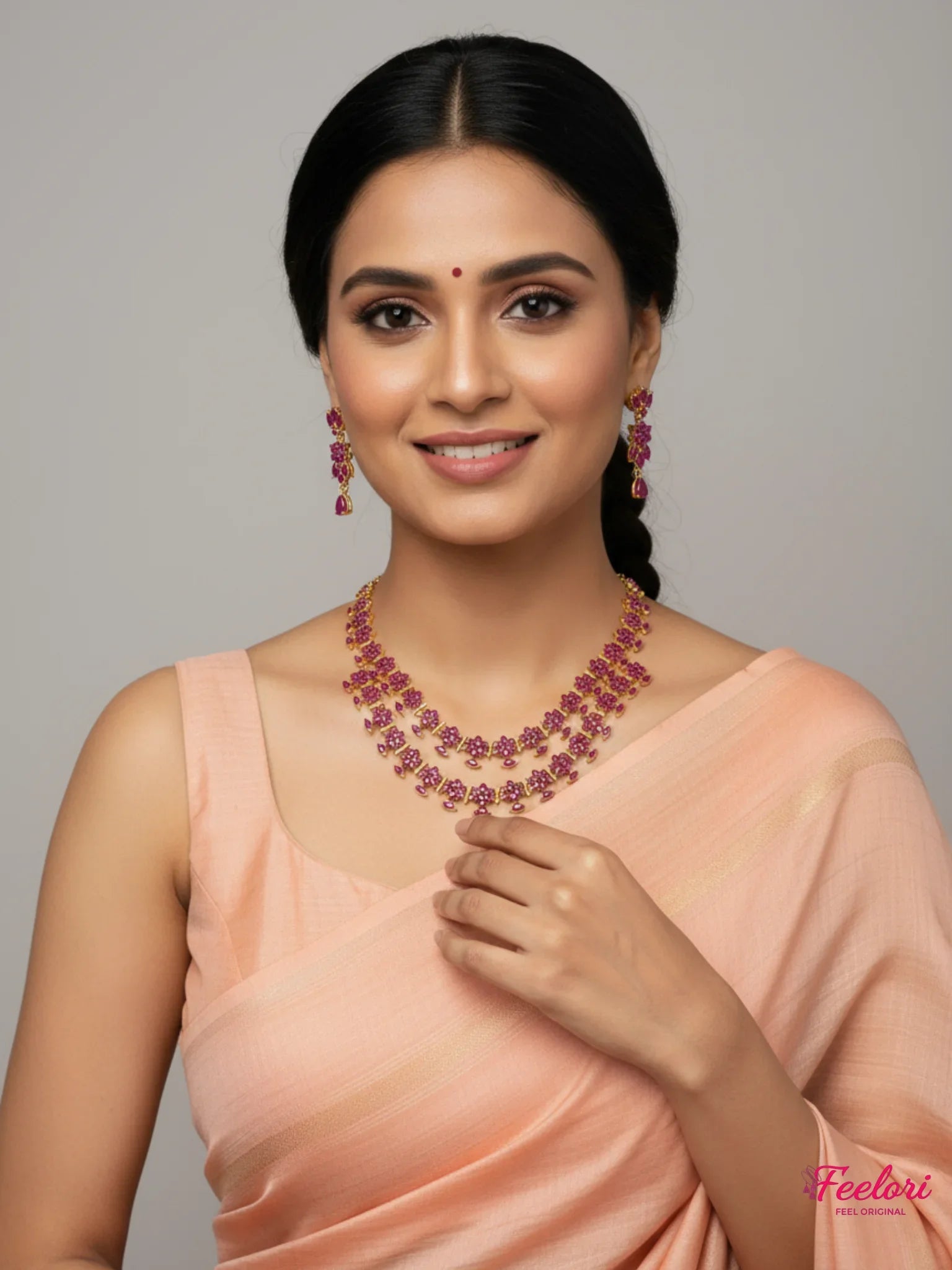 FeelOri Gold Plated Ruby Necklace Set - Model wearing elegant tiered floral set with traditional saree.
