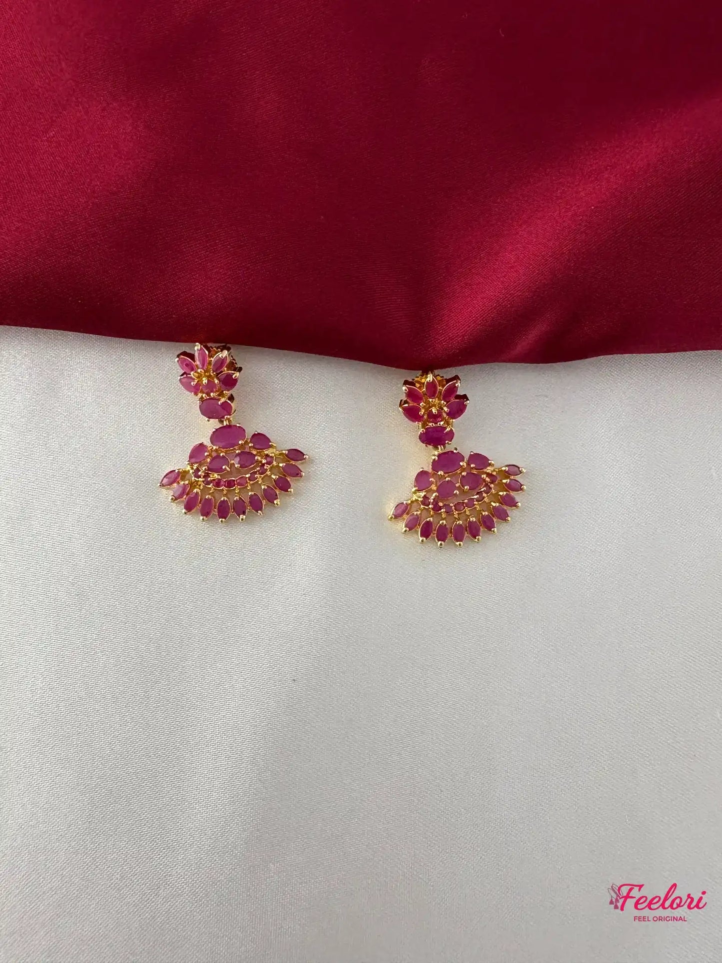 FeelOri Gold Plated Ruby Floral Earrings - Detailed view of the push-back earrings, highlighting the clustered ruby-hued stones in a fan-like floral design.