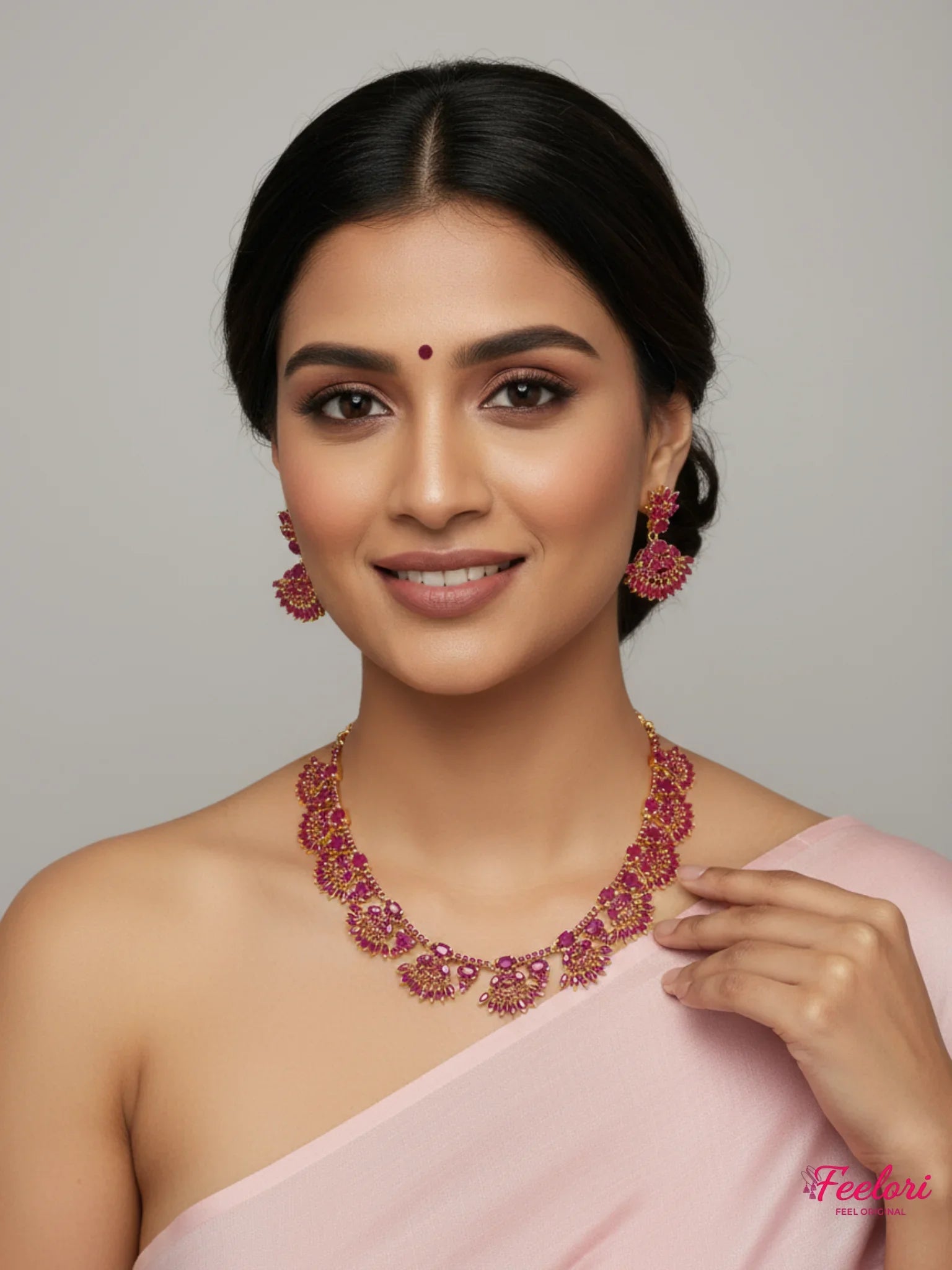 FeelOri Gold Plated Ruby Floral Necklace Set - Model in elegant sari, smiling with bindi.