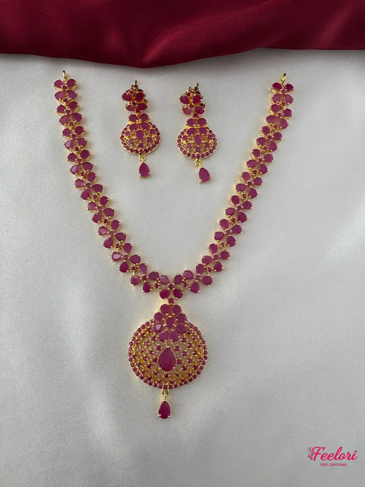 FeelOri Gold Plated Ruby Floral Necklace Set - Front view showcasing the intricate floral kundan work and drop pendant.