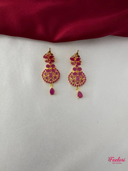 FeelOri Gold Plated Ruby Floral Earrings - Close-up view highlighting the detailed floral pattern and tear-drop ruby stone.