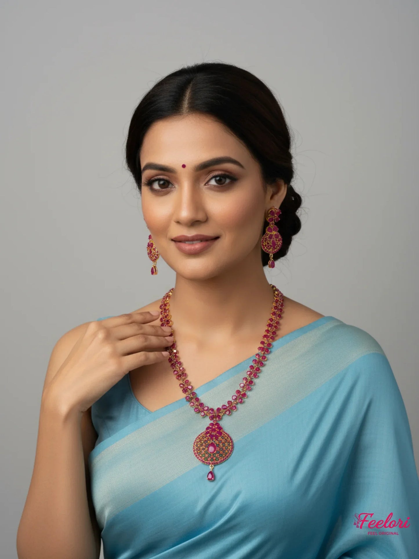 FeelOri Gold Plated Ruby Floral Necklace Set - Model wearing elegant set with light blue saree.